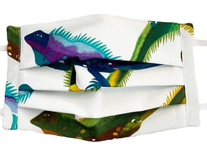 White fabric mask closeup with colourful iguanas pattern