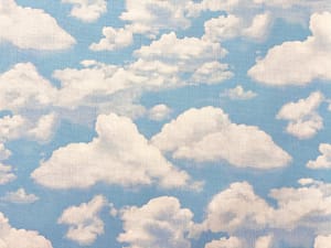 Light blue fabric with fluffy white clouds