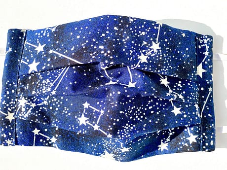 Glow in the Dark Constellations Mask Closeup | closeup of dark blue fabric with glow in the dark realistic constellations and background stars