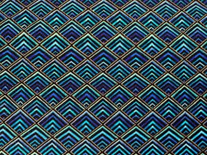 Shades of turquoise diamond tiled pattern in an art deco style with gold metallic outlines