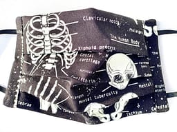 Glow in the Dark Skeletons Mask Closeup | black mask with glow in the dark white skeleton illustrations and labelled names of parts of human body