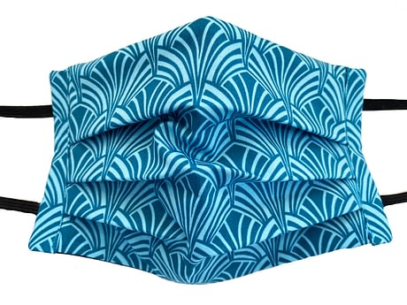 Turquoise fabric with ar deco style shaped pattern