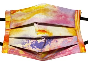 Sunset patterned fabric mask with a mix of golden, pink and purple colours