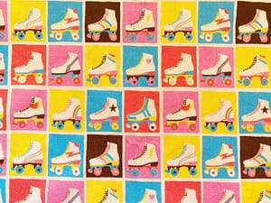 Multicoloured fabric with squares containing rollerskates in varying colours