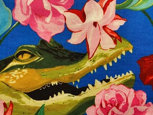 Blue fabric with large crocodile head and pink flowers