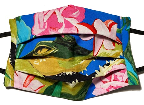 Blue fabric mask with large crocodile head and pink flowers