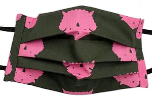Dark grey fabric with silhouette print of pink triceratops heads mask closeup