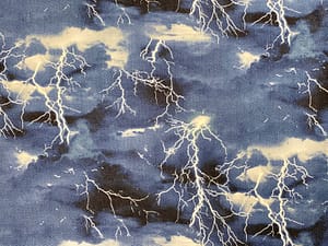 Dark blue and black fabric with lightning flashes pattern