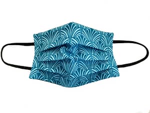 Turquoise fabric with ar deco style shaped pattern
