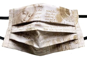 Parchment style fabric mask with DaVinci's handwriting notes on his inventions with drawings