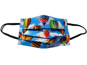 Blue fabric with multicoloured and varying sized hot air balloons pattern
