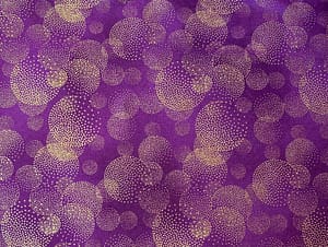 Purple fabric with overlapping gold metallic fireworks pattern