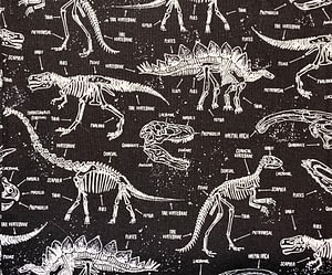 Black fabric with dinosaur skeleton pattern with labelled bones