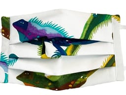 White fabric mask closeup with colourful iguanas pattern