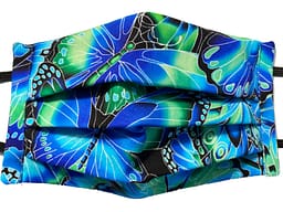 Blue green and black fabric with overlaying butterflies pattern