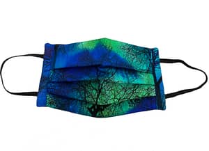 Dark blue fabric with aurora borealis pattern with silhouettes of a forest mask longshot